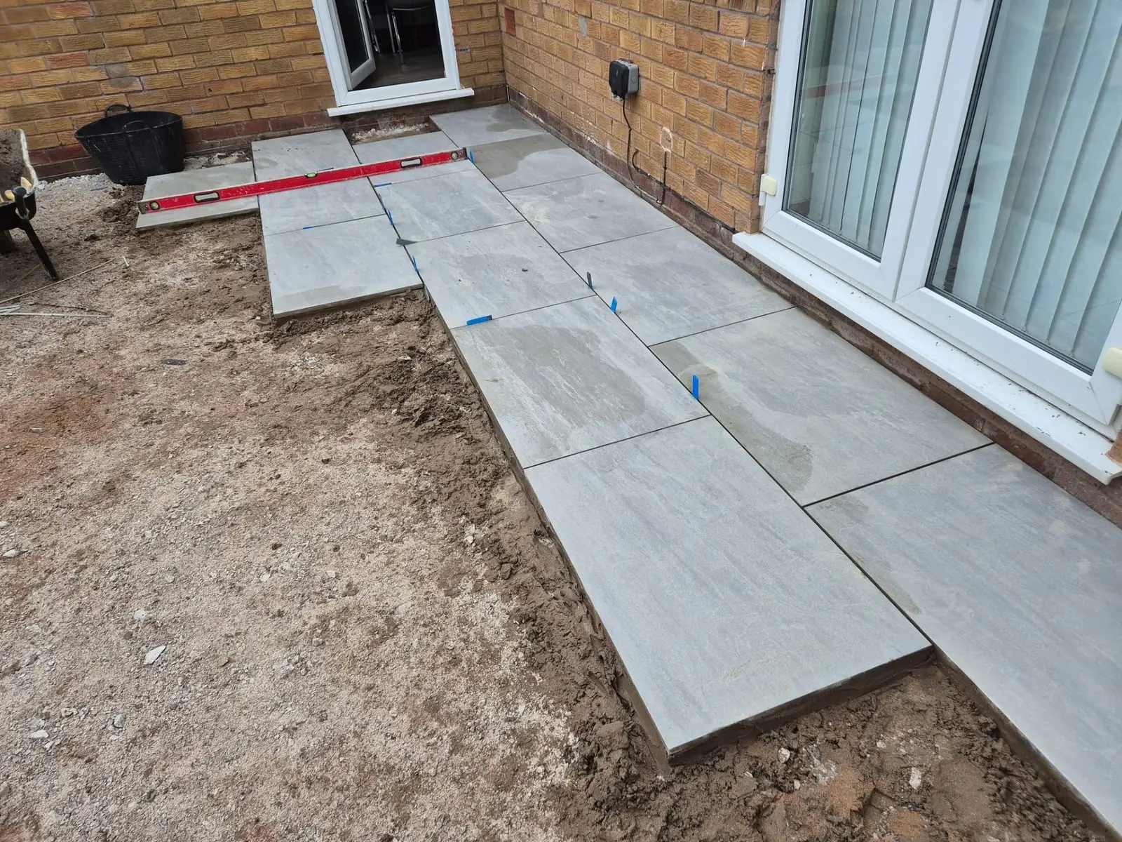 Levelling porcelain slabs beside the patio doors