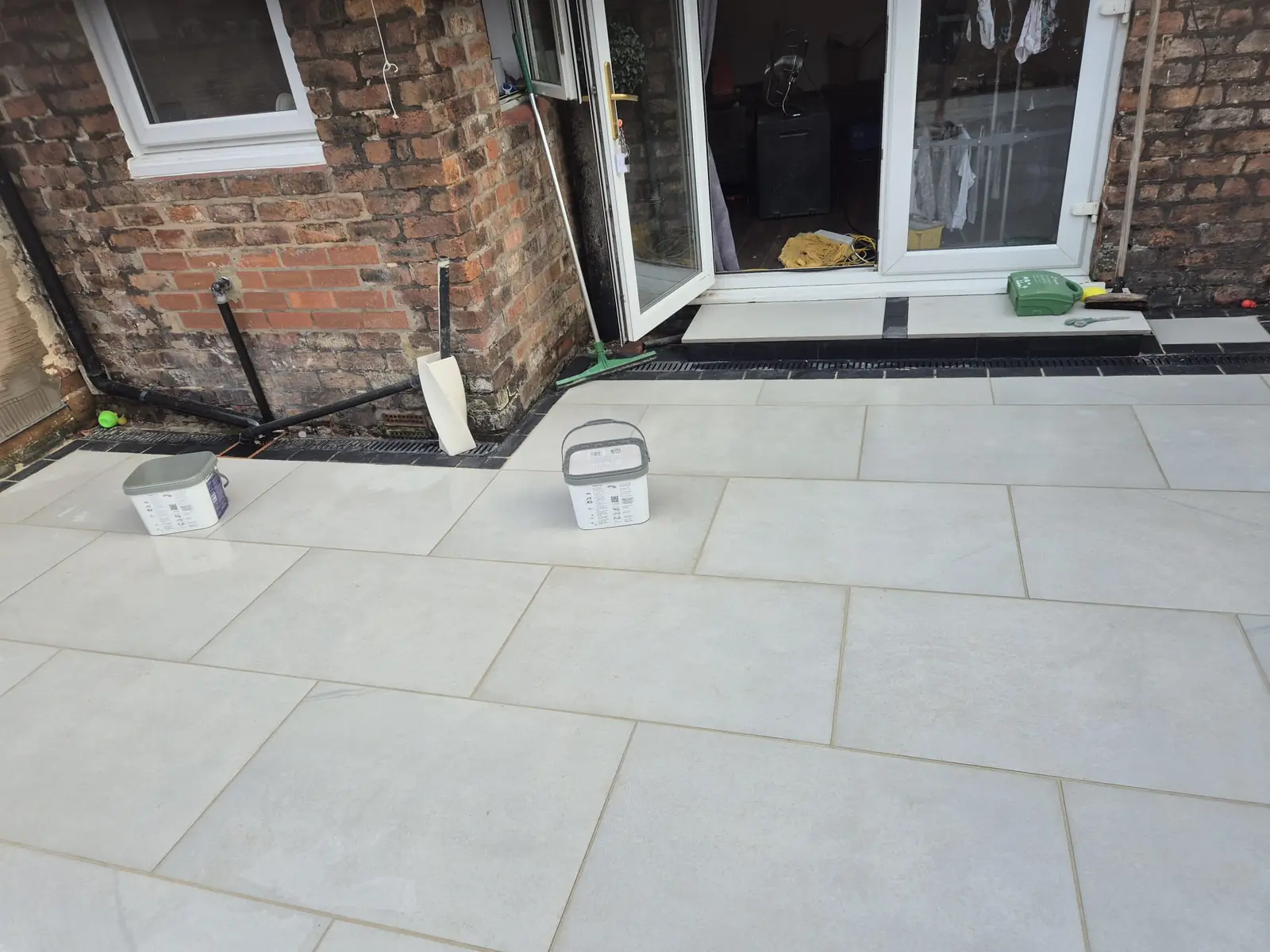 White porcelain patio with linear drainage channel and neat edging